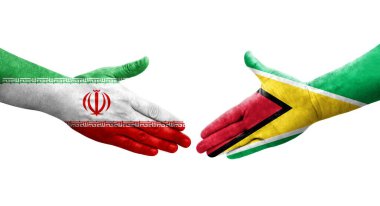 Guyana ve İran bayrakları arasındaki el sıkışma, izole şeffaf görüntü.