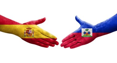 Haiti ve İspanya bayrakları arasındaki el sıkışma, izole şeffaf görüntü.