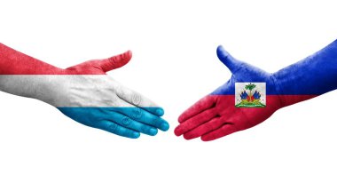 Haiti ve Lüksemburg bayrakları arasındaki el sıkışma, izole şeffaf görüntü.