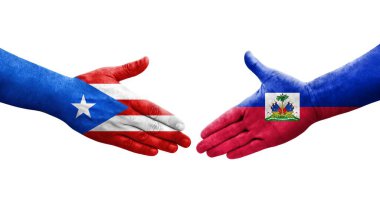 Haiti ve Porto Riko bayrakları arasındaki tokalaşma elleri boyalı, izole şeffaf görüntü.