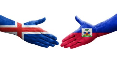 Haiti ve İzlanda bayrakları arasında el sıkışma, izole şeffaf görüntü.