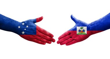 Haiti ve Samoa bayrakları arasındaki el sıkışma ellerinde resmedilmiş şeffaf görüntü.