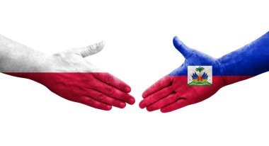 Haiti ve Polonya arasındaki el sıkışma ellerinde bayraklar, izole edilmiş şeffaf görüntü.
