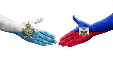 Haiti ve San Marino bayrakları arasındaki el sıkışma..