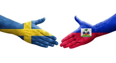 Ellerinde Haiti ve İsveç bayrakları arasında el sıkışma, izole şeffaf görüntü.