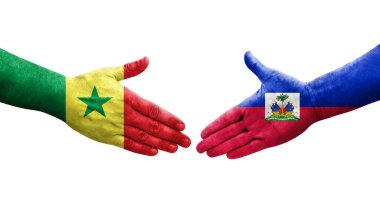 Haiti ve Senegal bayrakları arasındaki el sıkışma, izole şeffaf görüntü.