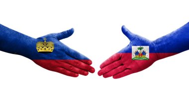 Haiti ve Lihtenştayn bayrakları arasındaki el sıkışma, izole şeffaf görüntü.