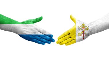 Kutsal Bakış ve Sierra Leone bayrakları arasındaki el sıkışma ellere boyanmış, izole şeffaf görüntü.