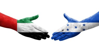 Honduras ve BAE bayrakları arasında el sıkışma, izole şeffaf görüntü.