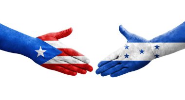 Honduras ve Porto Riko bayrakları arasındaki el sıkışma ellerinde izole şeffaf görüntü.