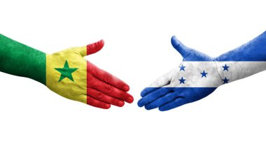 Honduras ve Senegal bayrakları arasında el sıkışma, izole şeffaf görüntü.