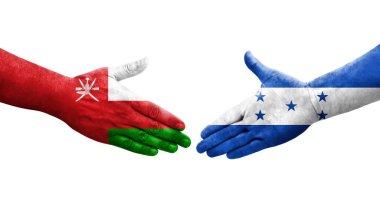 Honduras ve Umman bayrakları arasındaki el sıkışma ellerinde resmedilmiş şeffaf görüntü.