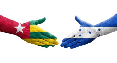 Ellerinde Honduras ve Togo bayrakları arasında el sıkışma, izole şeffaf görüntü.