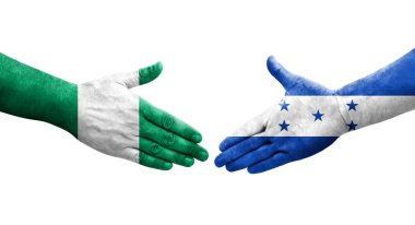 Honduras ve Nijerya bayrakları arasındaki el sıkışma ellerinde resmedilmiş şeffaf görüntü.