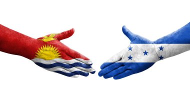 Honduras ve Kiribati bayrakları arasındaki el sıkışma, izole şeffaf görüntü.