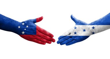 Honduras ve Samoa bayrakları arasındaki el sıkışma ellere boyanmış, izole şeffaf görüntü.