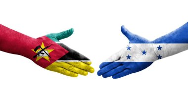 Honduras ve Mozambik bayrakları arasında el sıkışma, izole şeffaf görüntü.