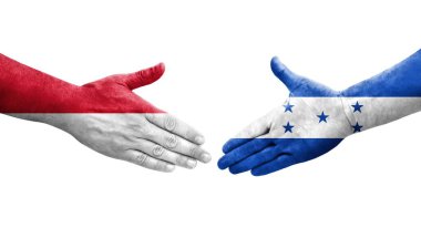 Honduras ve Monako bayrakları arasındaki el sıkışma ellerinde resmedilmiş şeffaf görüntü.