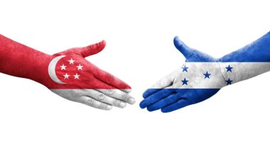 Honduras ve Singapur bayrakları arasındaki el sıkışma ellere boyanmış, izole şeffaf görüntü.
