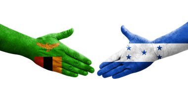 Honduras ve Zambiya bayrakları arasında el sıkışma, izole şeffaf görüntü.