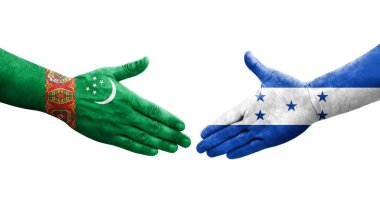 Honduras ve Türkmenistan bayrakları arasında el sıkışma, izole şeffaf görüntü.