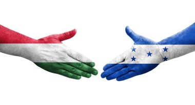 Honduras ve Macaristan bayrakları arasındaki el sıkışma, izole şeffaf görüntü.