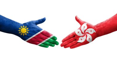 Hong Kong ve Namibya bayrakları arasındaki el sıkışma ellerinde izole şeffaf görüntü.