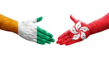 Hong Kong ve Fildişi Sahili bayrakları arasındaki el sıkışma..