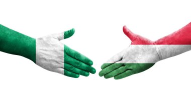 Macaristan ve Nijerya bayrakları arasındaki el sıkışma, izole şeffaf görüntü.