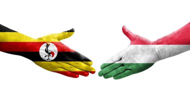 Macaristan ve Uganda bayrakları arasındaki el sıkışma, izole şeffaf görüntü.