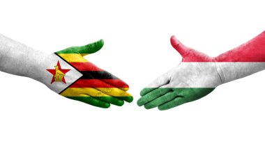 Macaristan ve Zimbabwe bayrakları arasında el sıkışma, izole şeffaf görüntü.