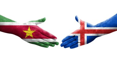 İzlanda ve Surinam bayrakları arasında el sıkışma, izole şeffaf görüntü.