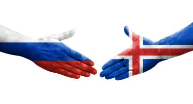 İzlanda ve Rusya arasındaki el sıkışma ellerinde bayraklar, izole edilmiş şeffaf görüntü.