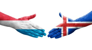 İzlanda ve Lüksemburg bayrakları arasında el sıkışma, izole şeffaf görüntü.