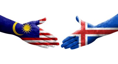 İzlanda ve Malezya bayrakları arasında el sıkışma, izole şeffaf görüntü.