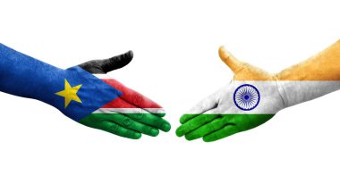 Hindistan ve Güney Sudan bayrakları arasındaki el sıkışma ellerinde resmedilmiş şeffaf görüntü.