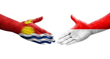 Ellerinde Endonezya ve Kiribati bayrakları arasında el sıkışma, izole şeffaf görüntü.