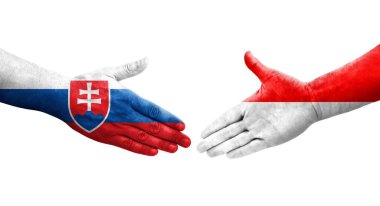 Ellerinde Endonezya ve Slovakya bayrakları arasında el sıkışma, izole şeffaf görüntü.
