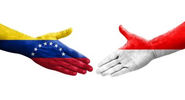Endonezya ve Venezuela bayrakları arasındaki el sıkışma ellerinde izole şeffaf görüntü.