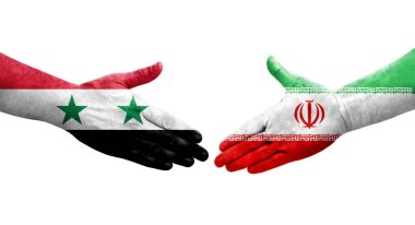 İran ve Suriye bayrakları arasında el sıkışma, izole şeffaf görüntü.