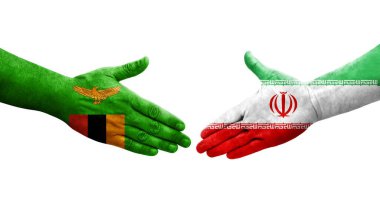 İran ve Zambiya bayrakları arasında el sıkışma, izole şeffaf görüntü.