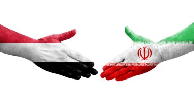 İran ve Yemen bayrakları arasındaki el sıkışma, izole şeffaf görüntü.