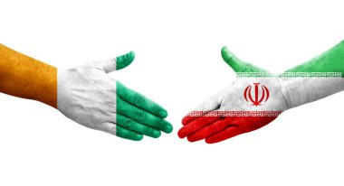 İran ve Fildişi Sahili bayrakları arasındaki el sıkışma, izole şeffaf görüntü.
