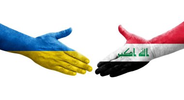 Irak ve Ukrayna bayrakları arasında el sıkışma, izole şeffaf görüntü.