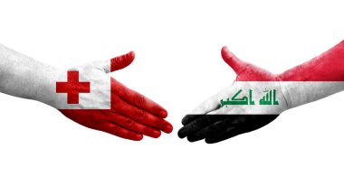 Irak ve Tonga bayrakları arasında el sıkışma, izole şeffaf görüntü.