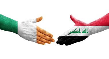 Irak ve İrlanda bayrakları arasında el sıkışma, izole şeffaf görüntü.