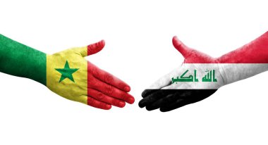 Irak ve Senegal bayrakları arasındaki el sıkışma, izole şeffaf görüntü.