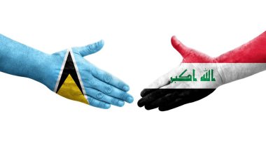 Irak ve Aziz Lucia bayrakları arasındaki el sıkışma, izole şeffaf görüntü.