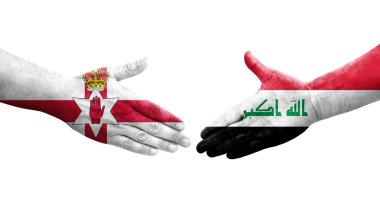 Irak ve Kuzey İrlanda bayrakları arasında el sıkışma, izole şeffaf görüntü.