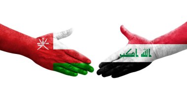 Irak ve Umman bayrakları arasındaki el sıkışma, izole edilmiş şeffaf görüntü.